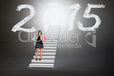 Composite image of woman walking with shopping bags