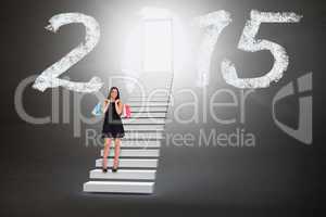 Composite image of woman walking with shopping bags