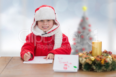 Composite image of cute boy drawing festive pictures