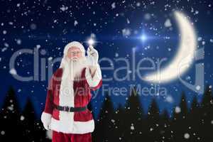 Composite image of santa writes something with a pen
