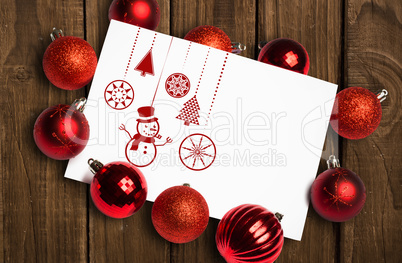 Composite image of hanging red christmas decorations