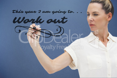 Composite image of serious businesswoman looking at pen in her h