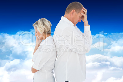 Composite image of upset couple not talking to each other after
