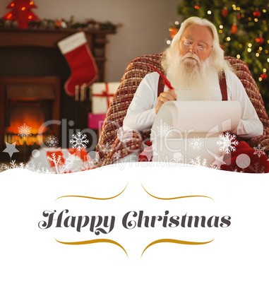 Composite image of relaxed santa writing list with a quill