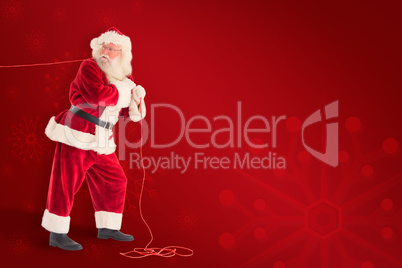 Composite image of santa pulls something with a rope