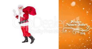 Composite image of santa holding a sack and waving