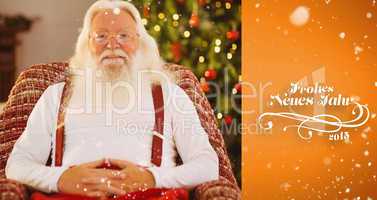 Composite image of smiling santa without his jacket relaxing