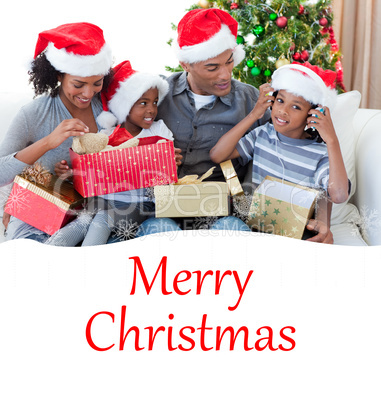 Composite image of happy family playing with christmas presents