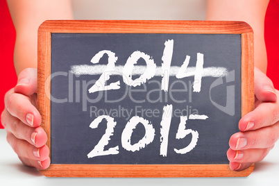 Composite image of females hands showing black board