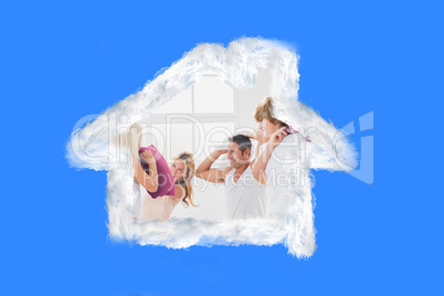 Composite image of family having fun with pillows