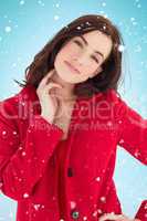Composite image of portrait of a cheerful brunette in red coat