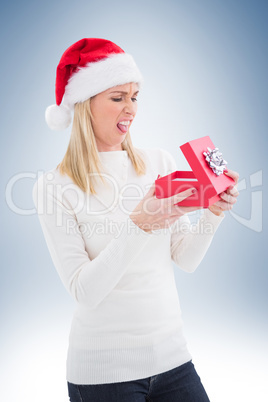 Disappointed blonde opening christmas gift