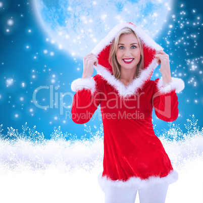 Composite image of festive blonde smiling at camera