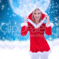 Composite image of festive blonde smiling at camera