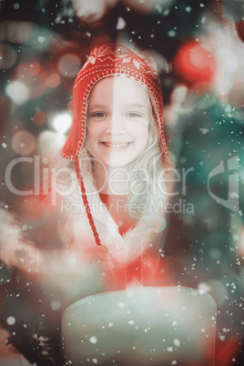 Composite image of festive little girl in hat and scarf