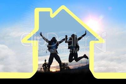 Composite image of silhouette couple jumping against the sky