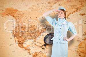 Composite image of pretty air hostess looking up