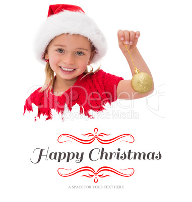 Composite image of cute little girl wearing santa hat holding ba