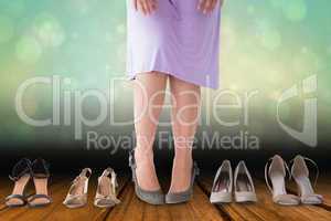 Composite image of mid section of woman in dress with heels