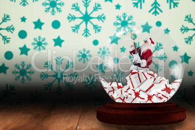 Santa rocking out in snow globe
