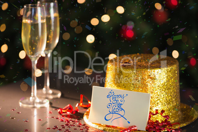 Happy new year card on table set for party