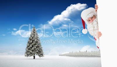 Composite image of smiling santa claus presenting sign