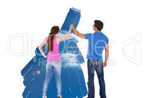 Composite image of couple painting together