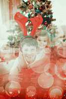 Composite image of happy brother and sister celebrating christma