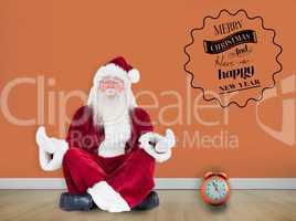 Composite image of santa claus sits and meditates