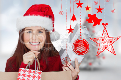 Composite image of woman with gifts