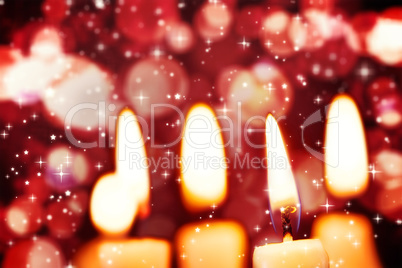 Twinkling stars against candle burning