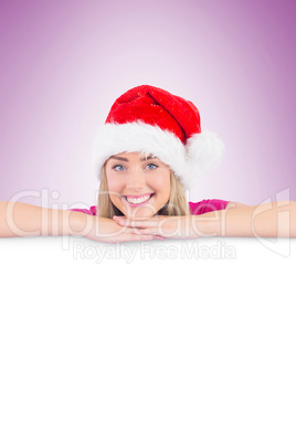 Festive blonde leaning on large poster