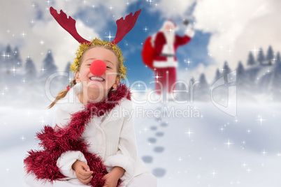 Composite image of cute little girl wearing red nose and tinsel