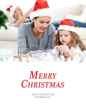 Composite image of mother and daughter unwrapping a present lyin