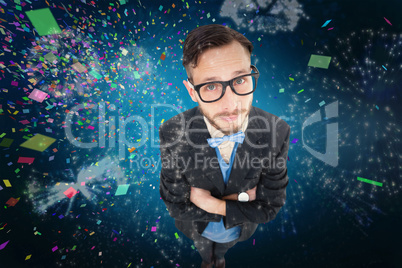 Composite image of geeky hipster looking at camera