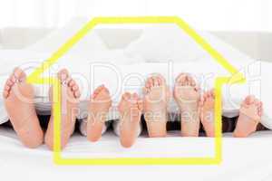 Composite image of feet in bed pointing straight up