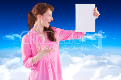 Composite image of woman shocked looking at paper