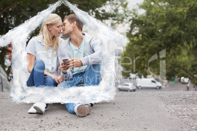 Composite image of cute young couple sitting on skateboard kissi