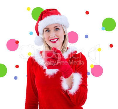 Composite image of festive blonde holding a mug