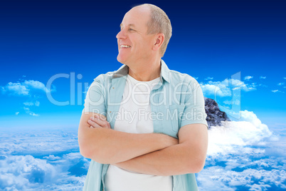 Composite image of happy older man with arms crossed