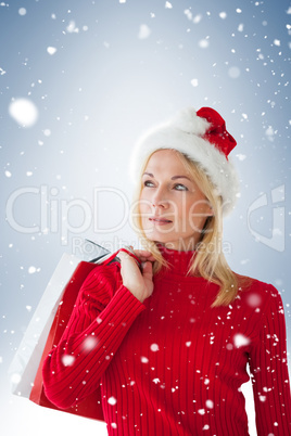 Happy festive blonde with shopping bags