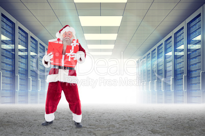 Composite image of santa carrying gifts