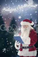 Composite image of santa uses a tablet pc