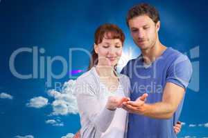 Composite image of couple holding out their hands