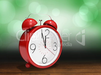 Composite image of alarm clock counting down to twelve