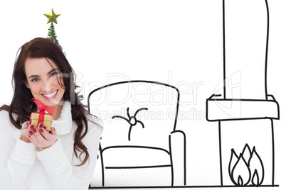 Composite image of portrait of a brunette holding gild gift