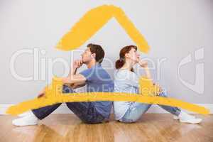 Composite image of couple sitting on floor together