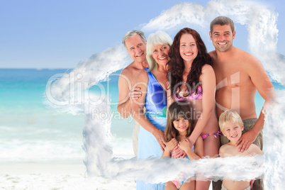 Composite image of portrait of a joyful family at the beach