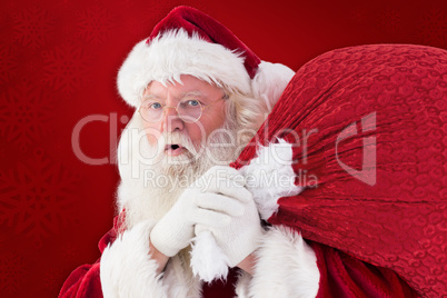 Composite image of santa takes care about his sack