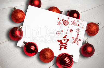 Composite image of hanging red christmas decorations